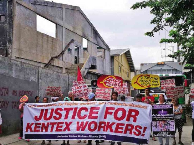 Families who lost a member in the 2015 Kentex factory fire in Valenzuela City, along with survivors and a workplace safety NGO, return to the site of the tragedy to call on President Duterte to help them get justice.  —contributed photo