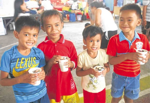 Marawi children enjoy their Mingo meals, courtesy of donations raised by ordinary citizens. —CONTRIBUTED PHOTO