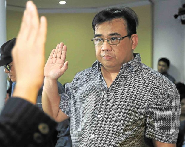 HAZING PROBE Horacio Castillo Jr. takes his oath at the Department of Justice on Monday during the preliminary investigation into the death of his son allegedly at the hands of Aegis Juris members. —EDWIN BACASMAS