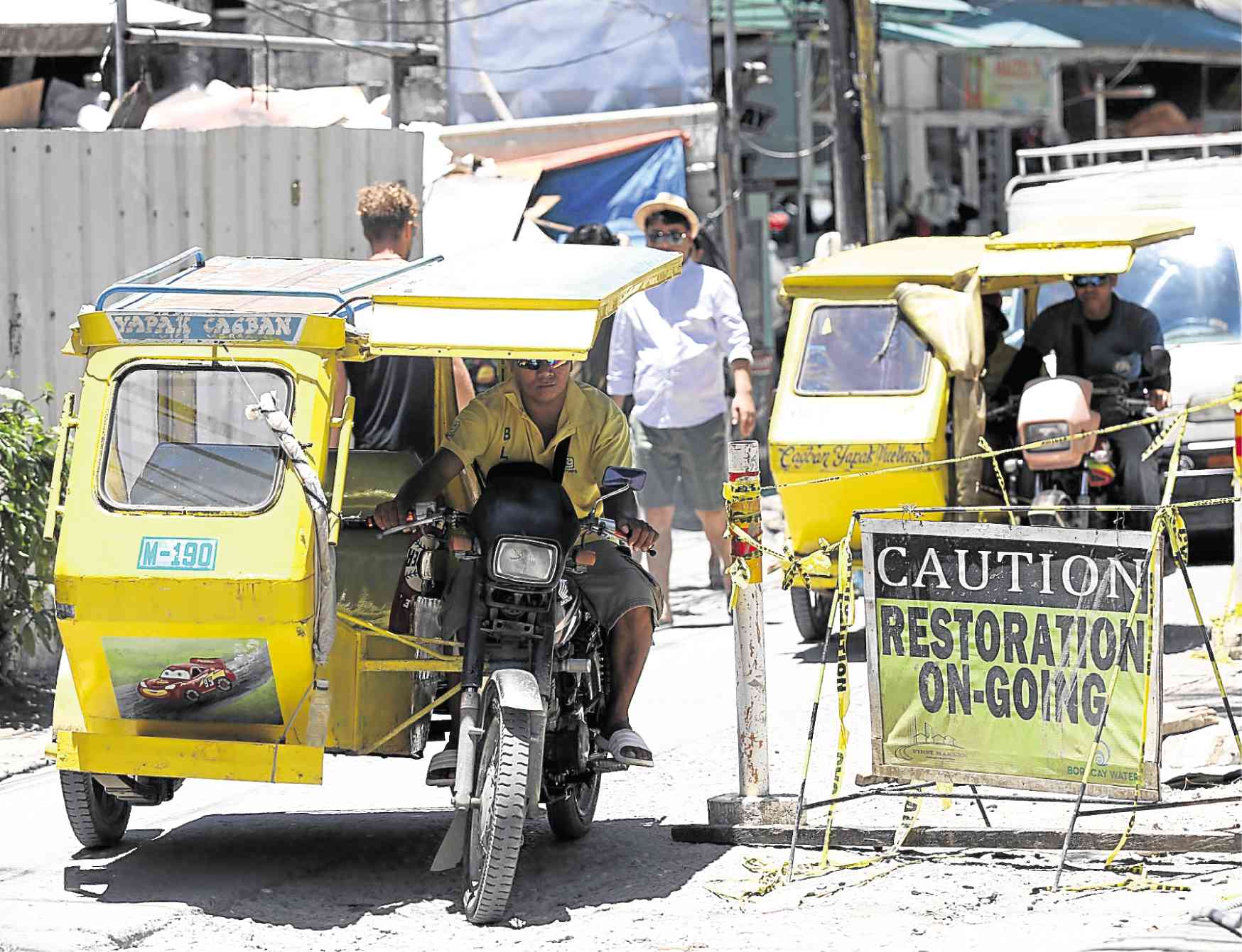 Town execs running Boracay get gas-fed tricycles off streets