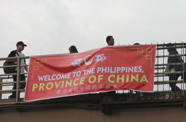 People behind ‘province of China’ banners crazy, traitors–Palace