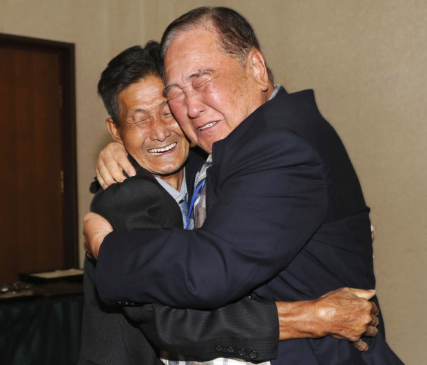 FILE - In this Aug. 20, 2018, file photo, South Korean Ham Sung-chan, 93, right, hugs his North Korean brother Ham Dong Chan, 79, during the Separated Family Reunion Meeting at the Diamond Mountain resort in North Korea. After nearly 70 years of a separation forced by a devastating 1950-53 war that killed and injured millions and cemented the division of the Korean Peninsula into North and South, Ham and his North Korean brother only got a total of 12 hours together. (Lee Ji-eun/Yonhap via AP. File)
