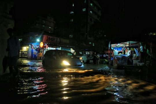 Water floods into residential areas in Yangon