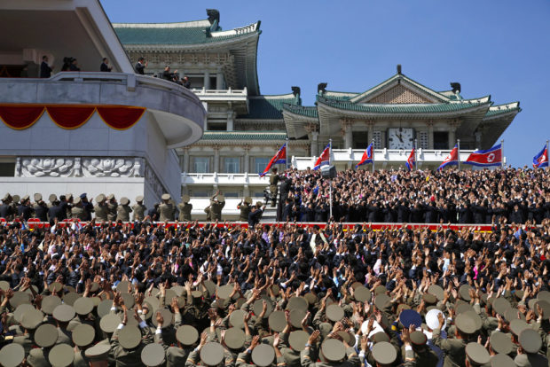 North Korea stages huge parade, holds back on advanced missiles