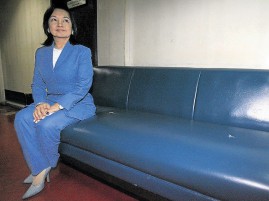 LADY IN WAITING.  Former President and now Pampanga Rep. Gloria Macapagal-Arroyo waits at the Department of Justice in Manila on Friday to swear to the authenticity of her affidavit answering the plunder charges filed against her by former Solicitor General Frank Chavez. REUTERS