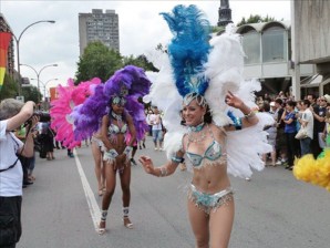 Dancers in costume march in the annual Gay Pride parade August 14, 2011 in Montreal, Canada. Thousands of gay, lesbian, bisexual and transsexual activists and their friends marched on Sunday in Montreal for the traditional Gay Pride parade. AFP PHOTO/ Michel VIATTEAU