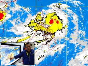 PAGASA-DOST MTSAT-EIR Satellite Image for 1 p.m., 26 September 2011 . Inset pic shows Department of Science and Technology (DOST) Undersecretary Graciano Yumul pointing the track of Typhoon Pedring (international name: Nesat) which was estimated to make landfall in Aurora Province Tuesday morning. MATIKAS SANTOS/INQUIRER.net
