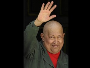  Venezuelan President Hugo Chavez waves at the Miraflores presidential palace in Caracas on October 1, 2011. Chavez said Saturday he is recovering from a cancer that was diagnosed more than three months ago. He was also confident that he will be re-elected in next year's elections and in the following , thus allowing him to remain in power until 2030. AFP PHOTO/LEO RAMIREZ