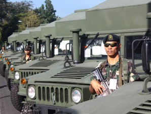 Soldiers stand at attention beside the military's 23 new High Mobility Multipurpose Wheeled Vehicle (HMMWV) ambulances as they were turned over Monday during the 72nd anniversary rites of the Department of National Defense in Camp Aguinaldo. The HMMWV, known as Humvee ambulance, is designed to for all types of roads, including cross-country terrains which are typical in conflict-affected development areas. Matikas Santos/INQUIRER.net