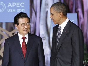 U.S. President Barack Obama greets Chinese President Hu Jintao before the APEC leaders dinner in Honolulu, on Saturday. AP Photo