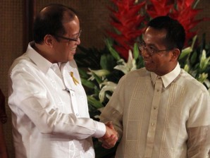 National Economic Development Authority Secretary Arsenio Balisacan is congratulated by President Benigno S. Aquino III shortly after taking his oath in Rizal Hall, Malacanang Palace.LYN RILLON