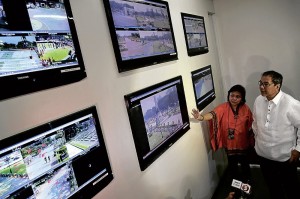 LUNETA LOOKOUTS  Tourism Secretary Ramon Jimenez Jr. and National Parks Development Committee Executive Director Juliet Villegas on Tuesday inspect the command center for the CCTV cameras installed around Rizal Park (also known as Luneta) to boost security in time for the holiday season. NIÑO JESUS ORBETA