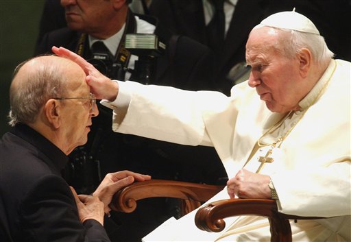 In this Nov. 30, 2004 file photo, Pope John Paul II gives his blessing to father Marcial Maciel, founder of the Legion of Christ, during a special audience at the Vatican. Pope Benedict XVI took over the Legion in 2010 after a Vatican investigation determined that Maciel had sexually molested seminarians and fathered three children by two women. Following a decision Thursday Feb. 14, 2013, by the Rhode Island Supreme Court, documents have been unsealed related to a lawsuit contesting the will of Gabrielle Mee, who left $60 million to the Legion. AP