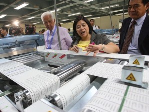 Commissioner Grace Padaca inspects sample ballots being printed at the National Printing Office in Quezon City. FILE PHOTO