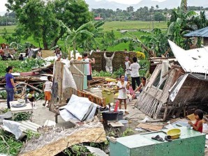 RESIDENTS of Sitio Libo in Barangay Mojon, Talisay City salvage what is left of their homes after a tornado struck their community on Tuesday. LITO TECSON/CEBU DAILY NEWS