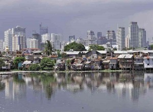 SKYLINE OVER POVERTY LINE  The towering buildings are at the heart of Makati City, while the shanties are along an estero in Pasay City.  INQUIRER FILE PHOTO