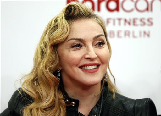 US pop star Madonna smiles during her visit at the "Hard Candy Fitness" center in Berlin in this October 17 file photo. AP