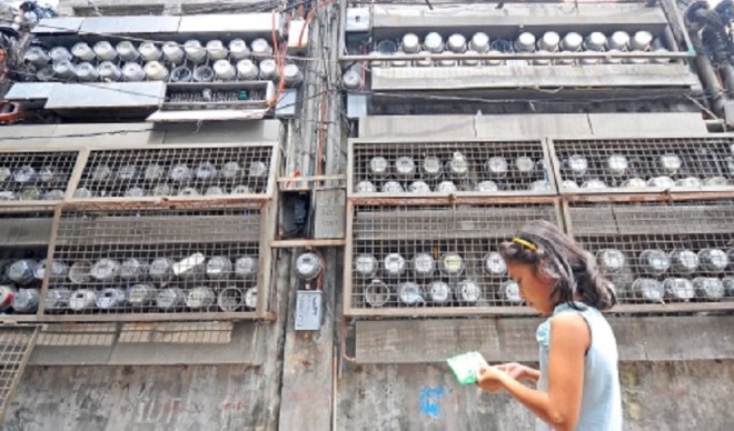 Meralco meters on a wall. STORY: Meralco rate hike in April biggest so far this year