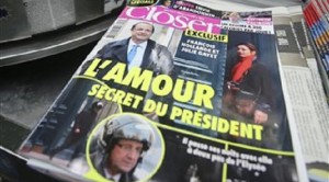The French magazine Closer with photos of French President Francois Hollande and French actress Julie Gayet on its front page, is presented in a newspaper stall on the Champs Elysee Avenue in Paris, Friday Jan. 10, 2013. AP FILE PHOTO