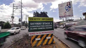 A traffic advisory for the construction of the Skyway Stage 3 project is displayed along Osmeña Highway in Manila.  RICHARD A. REYES