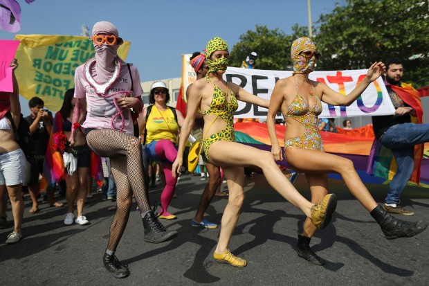 Gay rights supporters dance at Copacabana beach during a protest against homophobia in Rio de Janeiro, Brazil, Saturday, June 28, 2014. AP Photo