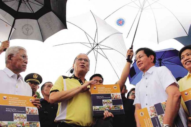 Presidential Assistant for Rehabilitation and Recovery Panfilo Lacson submits to President Aquino a copy of the master plan for the rehabilitation of areas hit by Supertyphoon “Yolanda,” one of the world’s strongest typhoons on record. Inquirer file photo by JOAN BONDOC