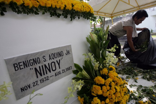 REMEMBERING NINOY A worker tidies up the tomb of the late Sen. Benigno “Ninoy” Aquino Jr. at Manila Memorial Park in Sucat, Parañaque City.