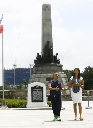 Sen Pia Cayetano Chairperson of the Senate Committee on Education , Arts and Culture  during ocular inspection of the sightline of the Rizal monument, rising behind it is the Torre De Manila  condominium with 19 floors completed. Also in photo is cultural activist  Carlos Celdran. JOAN BONDOC