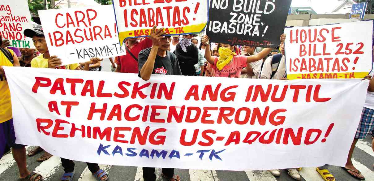 ANGRY messages are attention-grabbers in the protest rallies of militants demanding genuine reforms, like this one during the 26th year of the  Comprehensive Agrarian Reform Program  in June held by farmers near the Aquino residence on Times Street in Quezon City. LEO M. SABANGAN II