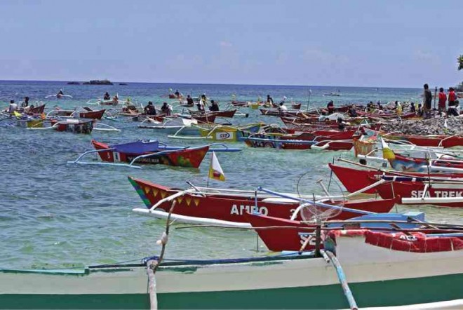 MANY survivors of Yolanda are not begging for aid, only for the means to return to work, which some foundations answered through donations of fishing boats like these for fishermen who lost their boats.  LITO TECSON/CDN FILE PHOTO 
