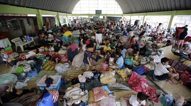 Residents continue to be housed in evacuation centers Saturday, Sept. 20, 2014 in Marikina city east of Manila, Philippines. AP