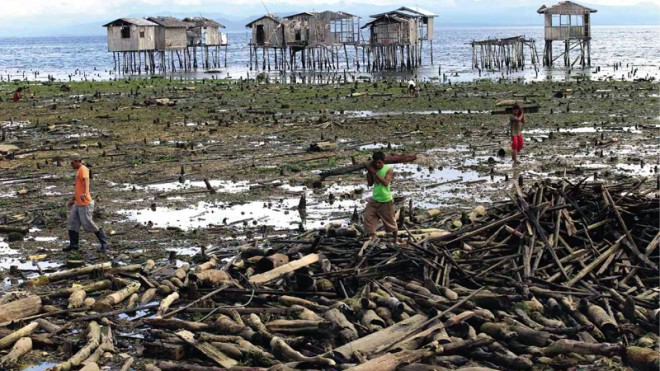 A YEAR AFTER THE BATTLE  Damaged houses on stilts still stand on the shore at Mariki village in Zamboanga City, which Moro National Liberation Front rebels torched when government forces thwarted their attempt to seize the city in September last year. A year after the battle, thousands of residents of Zamboanga City remain homeless and in dire need of government help.  JEOFFREY MAITEM/INQUIRER MINDANAO