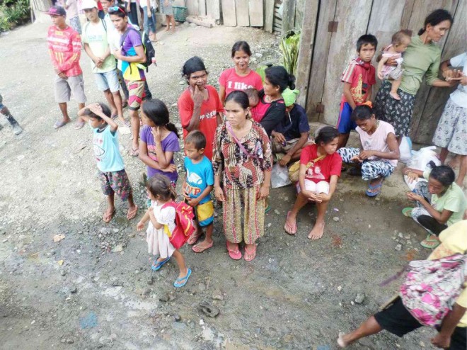 MEMBERS of Ata-Manobo tribe wait for food packs being distributed by the local government of Kapalong town in Davao del Norte province. CONTRIBUTED PHOTO 