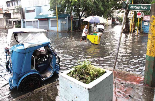 CHINO Roces Avenue was back to its usual rainy-day self on Tuesday, one of the major thoroughfares in Makati City that went underwater after a brief thunderstorm. INQUIRER PHOTO