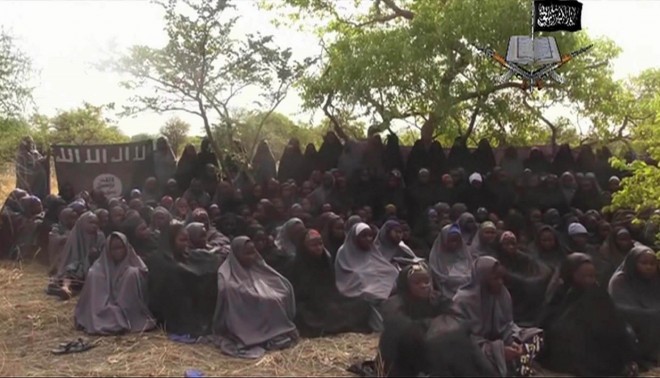 FILE - This Monday May 12, 2014 file image taken from video by Nigeria's Boko Haram terrorist network, shows the alleged missing girls abducted from the northeastern town of Chibok. Nigerias government and Islamic extremists from Boko Haram have agreed to an immediate cease-fire, officials said Friday Oct. 17, 2014. The fate of more than 200 missing schoolgirls abducted by the insurgents six months ago remains unclear. Defense Ministry spokesman Maj. Gen. Chris Olukolade said their release is still being negotiated. AP FILE PHOTO