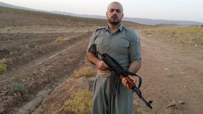 In this image provided by Shaho Pirani shows Shaho Pirani posing with an automantic weapon near the village of Koya in Iraqi Kurdistan in June 2014. The Iranian Kurd living in Denmark, was on a month-long training camp for the Kurdish diaspora organized by Iranian branch of the Kurdistan Democratic Party. He joined Kurds from Norway, Switzerland and Britain for a crash-course on politics followed by weapons training. Shaho Pirani says he's just a phone call away from leaving his quiet life in Denmark and joining Kurdish forces battling against Islamic State militants in Iraq. The 30-year-old Kurd, who fled from Iran with his older brother in 1991, says he feels a moral duty to help the Peshmerga, the armed forces of the Kurdistan Regional Government, to fight the "psychopaths" of the IS group. (AP Photo/Shaho Pirani)