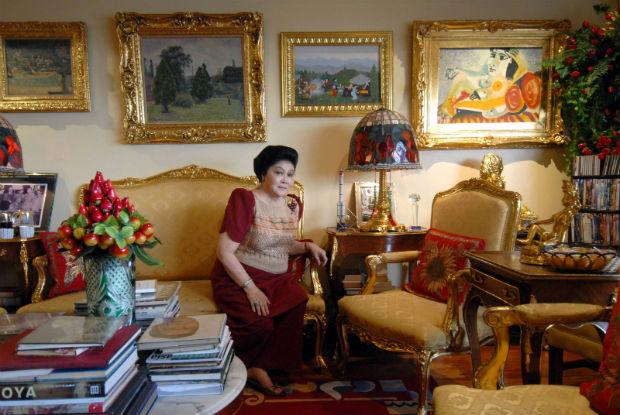 This file photo taken on June 7, 2007 shows former first lady Imelda Marcos is seen in her apartment in Manila with a gallery of paintings including a Picasso, seen at upper right.  AFP/ROMEO GACAD