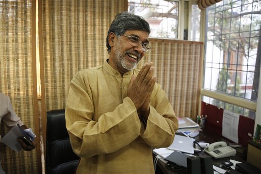 Indian children's rights activist Kailash Satyarthi gestures as he addresses the media at his office in New Delhi, India, Friday, Oct. 10, 2014. Malala Yousafzai of Pakistan and Satyarthi of India jointly won the Nobel Peace Prize on Friday, Oct. 10, 2014, for risking their lives to fight for children's rights. AP