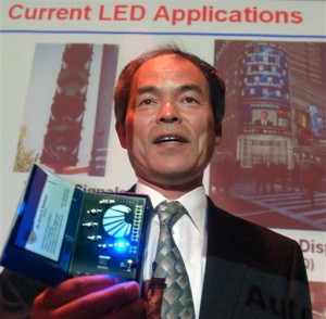 FILE - In this June 15, 2006 file photo, Prof. Shuji Nakamura demonstrates different LED lights during a presentation in Santa Barbara, Calif. when he was awarded the $1.2 million Millennium Technology Prize for revolutionary inventions in light and laser technology. Nakamura along with Isamu Akasaki and Hiroshi Amano of Japan won Tuesday, Oct. 7, 2014 the Nobel Prize in physics for the invention of blue light-emitting diodes  a new energy efficient and environment-friendly light source. (AP Photo/The News Press, Steve Malone, File) NO SALES