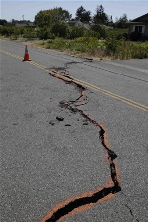 This file photo from Aug. 24, 2014, shows a cracked section of roadway following an earthquake in Napa, Calif. AP