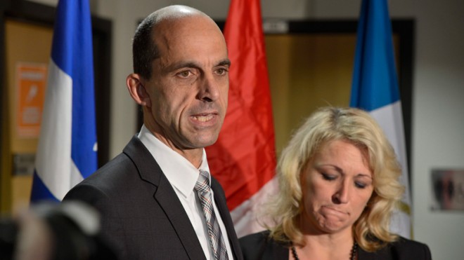 Canadian Public Safety Minister Steven Blaney and Quebec Public Security Minister Lise Theriault address reporters at a news conference in St-Jean-sur-Richelieu, Quebec, on Tuesday Oct. 21, 2014. One of two soldiers hit by a car on Monday in Saint-Jean-sur-Richelieu, Quebe, died of his injuries early Tuesday, according to Quebec provincial police. An official familiar with the case said the suspect, Martin Couture Rouleau, 25, of Saint-Jean-sur-Richelieu, Quebec, was influenced by radical Islamists. (AP Photo/The Canadian Press, Paul Chiasson)