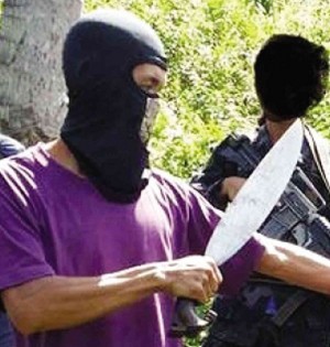 UNDATED photo from the private terrorism monitor SITE Intelligence Group on Sept. 23 is reported to show members of the Abu Sayyaf who had held captive two German nationals released allegedly after payment of a P250-million ransom. AFP/SITE INTELLIGENCE GROUP
