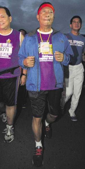 RUNNING WITH BOY SCOUTS  Vice President Jejomar Binay, also national president of the Boy Scouts of the Philippines (BSP), jogs at Rizal Park in Manila during the BSP Run 2014 in celebration of 100 years of scouting in the country.  NIÑO JESUS ORBETA