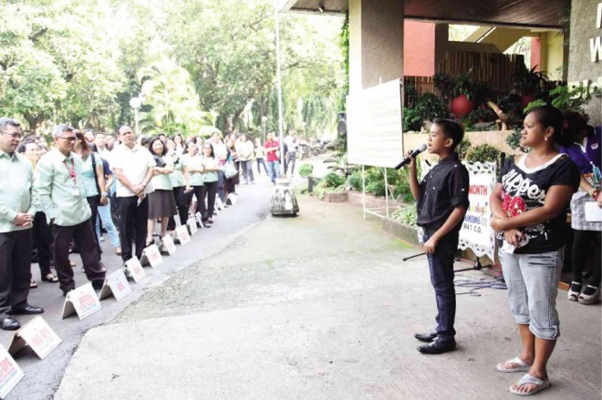 YOUNG ACHIEVER  4Ps ‘model child’ Angelo Urbano Caigas addresses DSWD personnel during Monday’s flag ceremony. DSWD photo