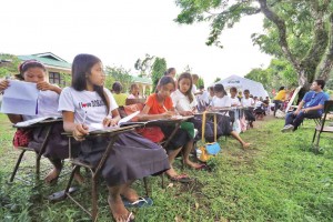 STUDENTS of Camalig North Central School in Camalig town, Albay province, attend classes outdoors while their classrooms serve as temporary homes for families evacuated from danger zones around Mayon Volcano. MARK ALVIC ESPLANA/INQUIRER SOUTHERN LUZON FILE PHOTO