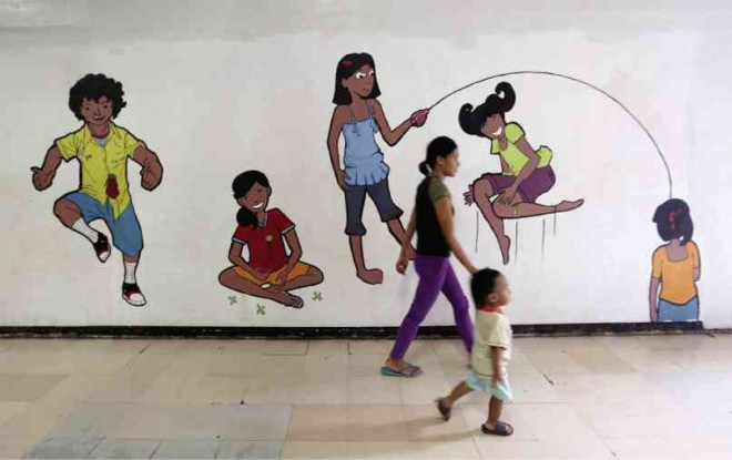 NO KID’S STUFF There may be a playful ambiance in the hallways of the Philippine Children’s Medical Center, but serious questions remain about its future in the hospital’s current location in Quezon City.  photos by LYN RILLON 