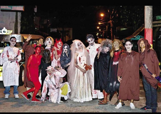 PHOTO taken in 2011 in Sariaya, Quezon shows participants in the annual ‘pangangaluluwa’ event of the Sariaya Tourism Council wearing Halloween costumes.        CONTRIBUTED PHOTO