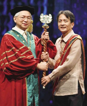 DR. MICHAEL Tan (right) is affirmed by UP President Alfredo Pascual as the 10th UP Diliman chancellor in a ceremony held at the University Theater in UP Diliman, Quezon City. EDWIN BACASMAS 