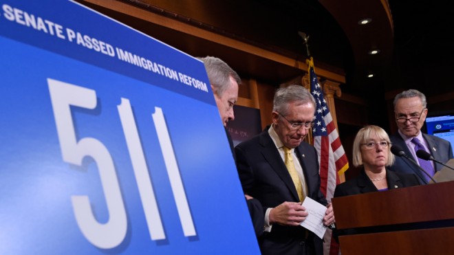Senate Majority Leader Harry Reid of Nev., second from left, steps back from the podium, during an immigration reform news conference, Thursday, Nov. 20, 2014, on Capitol Hill in Washington, From left are, Senate Majority Whip Richard Durbin of Ill., Reid, Sen. Patty Murray, D-Wash. and Sen. Charles Schumer, D-N.Y. The sign states the number of days since the Senate passed immigration reform legislation. (AP Photo/Susan Walsh)
