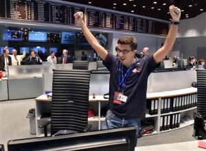 The picture released by the European Space Agency ESA on Wednesday, Nov. 12, 2014, a scientist reacts in the main control room at the European Space Agency after the first unmanned spacecraft Philae landed on the comet called 67P/Churyumov-Gerasimenko, at the control centre in Darmstadt, Germany, Wednesday, Nov. 12, 2014. AP